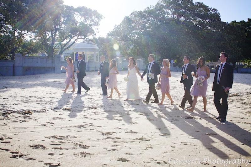 Bridal party walking along Balmoral Beach - wedding photography sydney